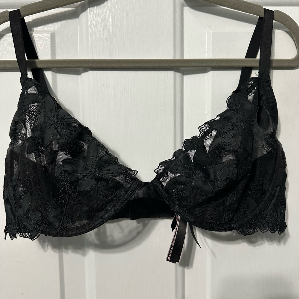 Victoria’s Secret lacy unlined bra. 36DD. Black. Never worn.